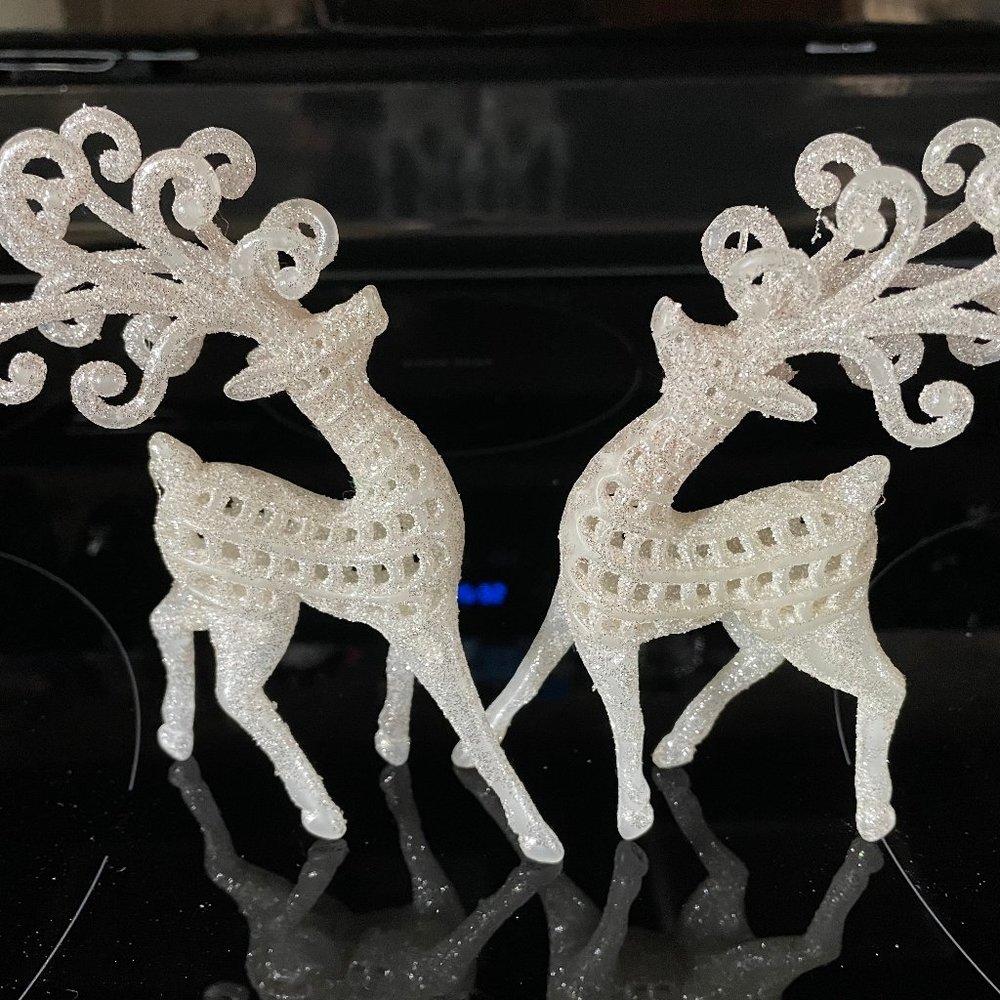 2 White Plastic Christmas Reindeer